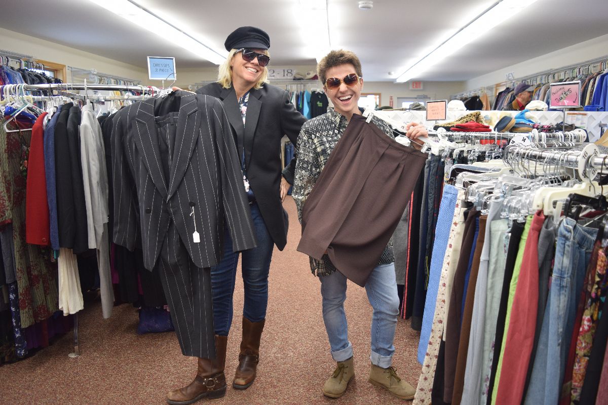  Blue Hill residents Julie Fehrle, a set designer, and Max Rhine, a Harbor School freshman, scout fashions from the TurnStyle Thrift Shop for their fashion show. The show, which will be held Thursday, March 29, at 6:30 p.m. at Mainescape Garden Center on South Street, will benefit the Tree of Life Food Pantry. PHOTO BY JENNIFER OSBORN 